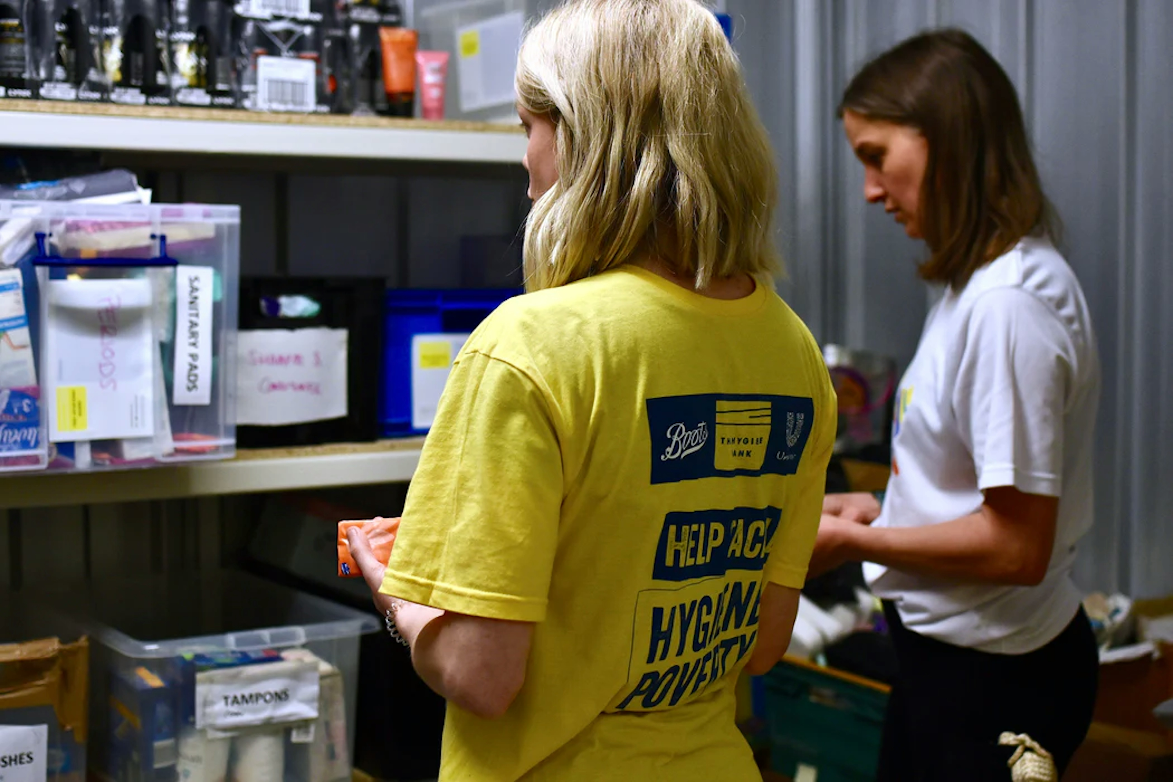 hygiene bank volunteers stacking hygiene products