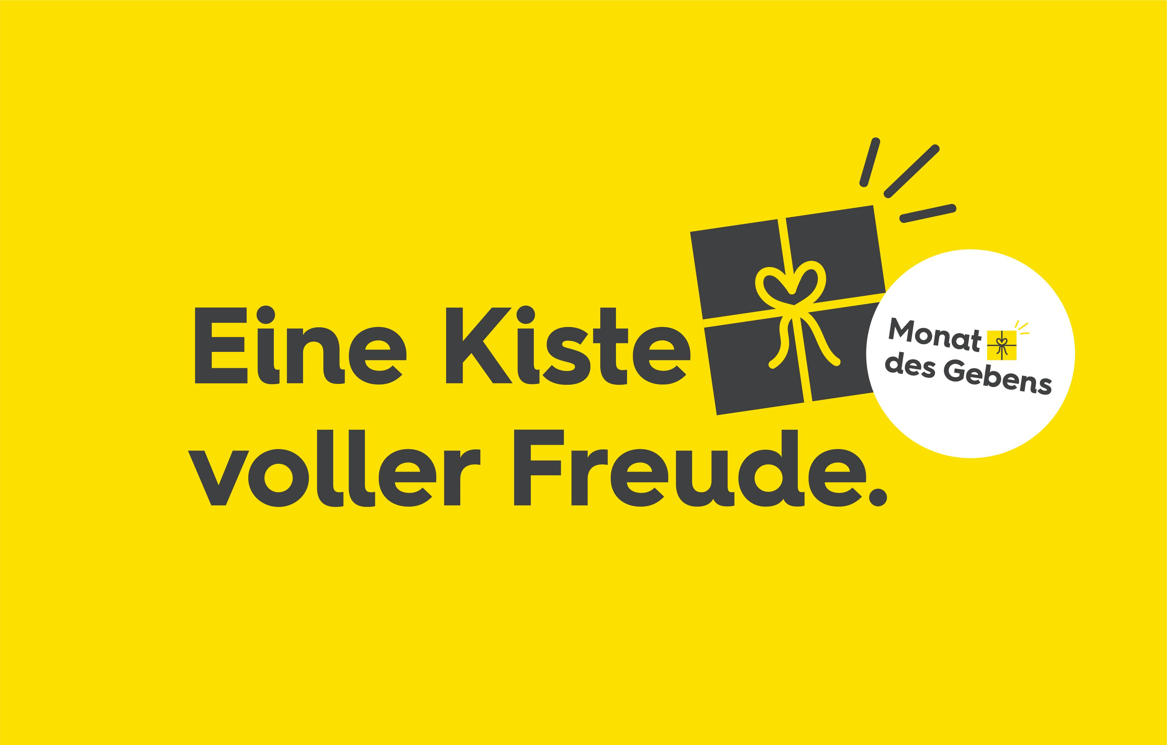 Text auf gelben Hintergrund mit Geschenk und Sticker. Text Hintergrund: Eine Kiste voller Freude. Text Sticker: Monat des Gebens