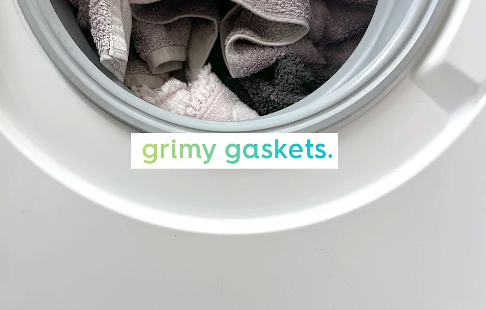 washing machine with text 'grimy gaskets'