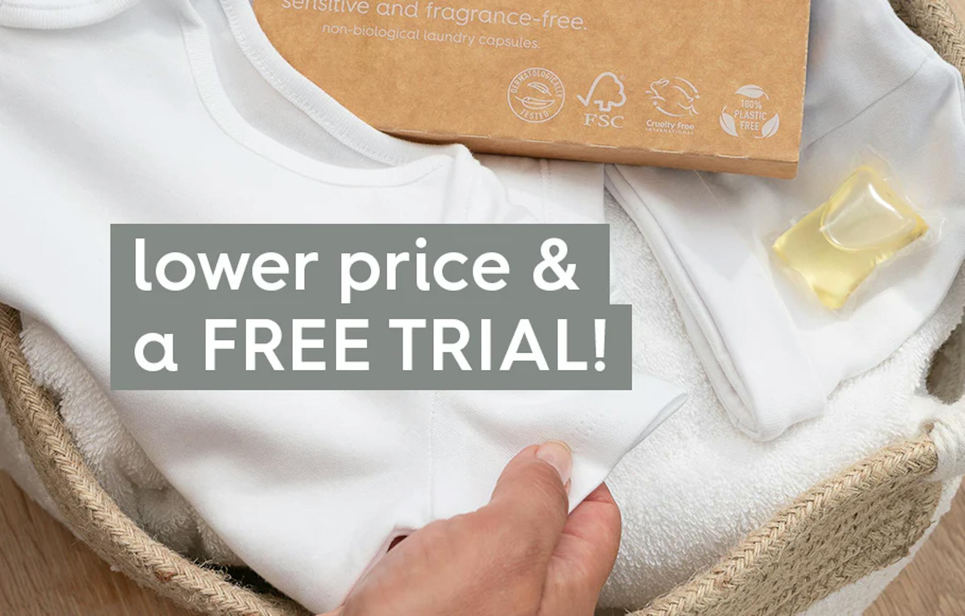 smol fragrance-free laundry capsules on top of a basket of white laundry. text: lower price and a free trial!