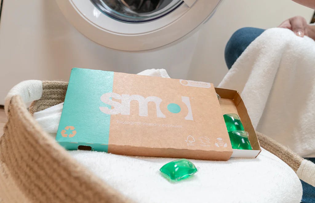 smol capsules in a laundry basket