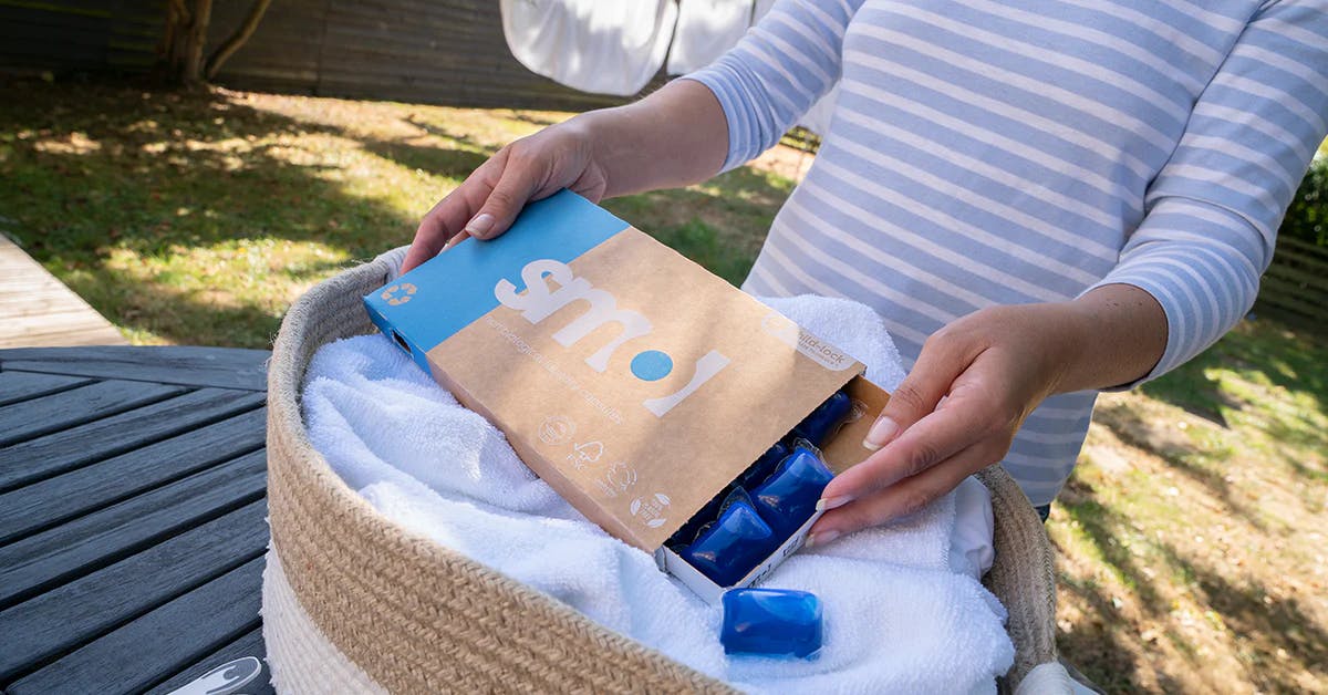 smol laundry capsules on a laundry basket