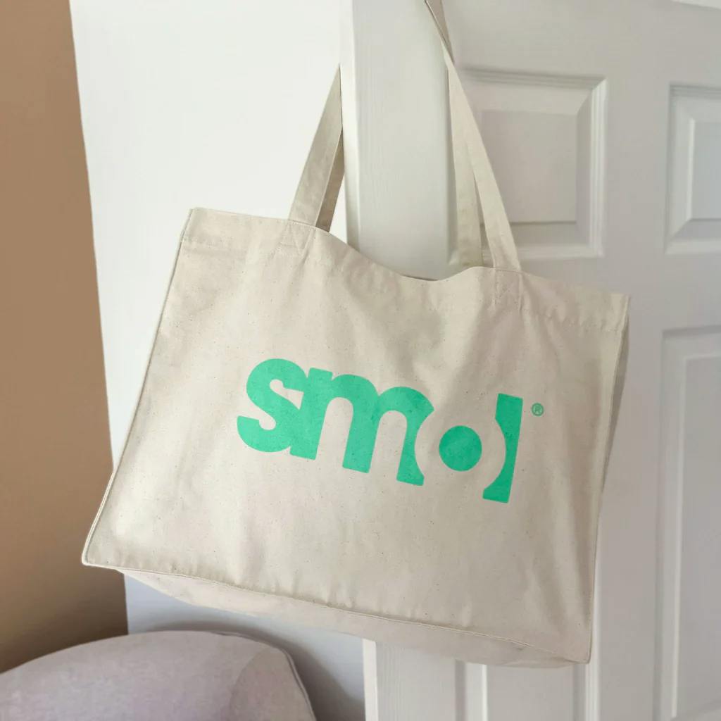 cream reusable tote bag with green smol logo