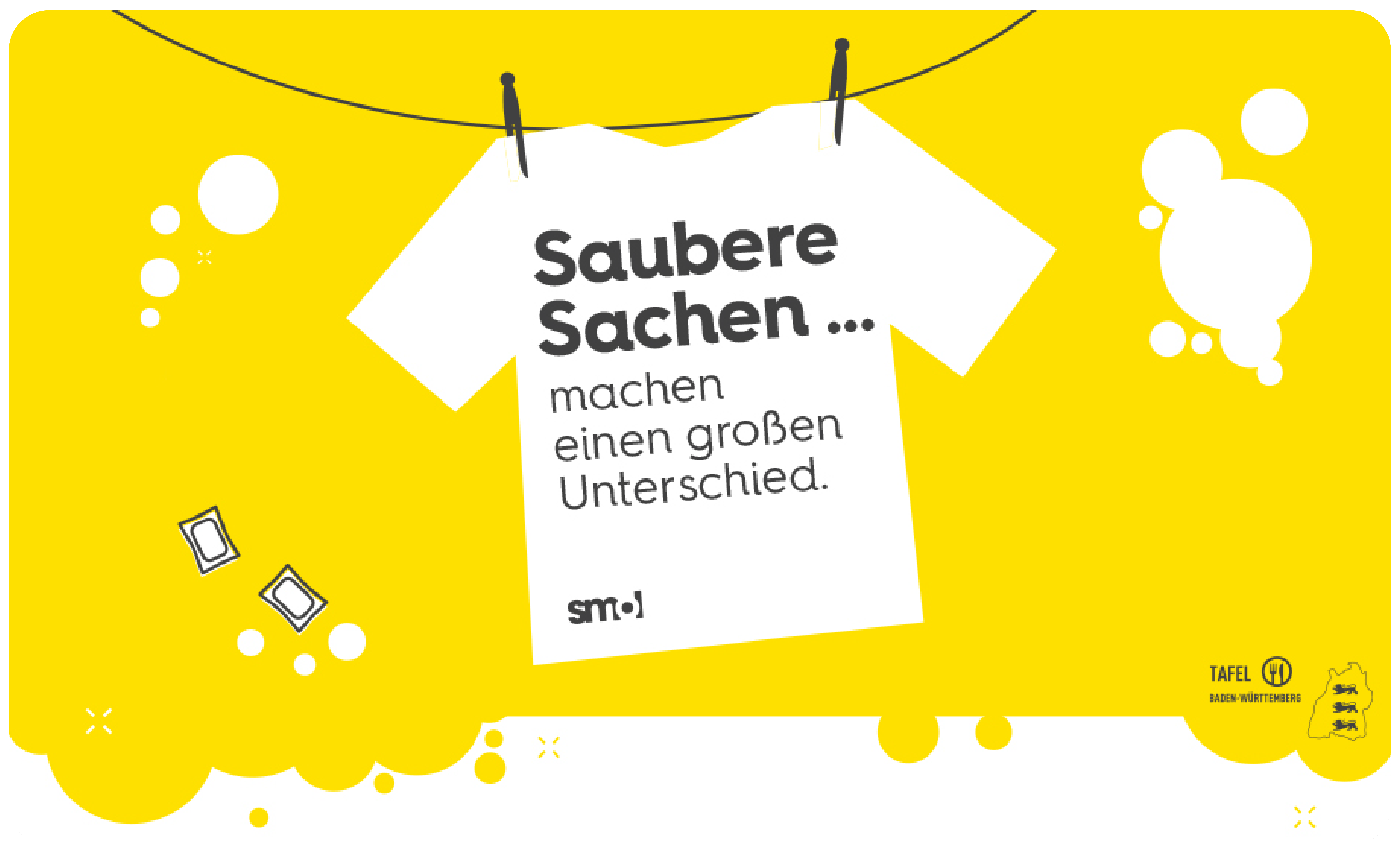 T-shirt an Wäscheleine mit Waschmittelkapseln und Blasen, text: Saubere Sachen … machen einen großen Unterschied.