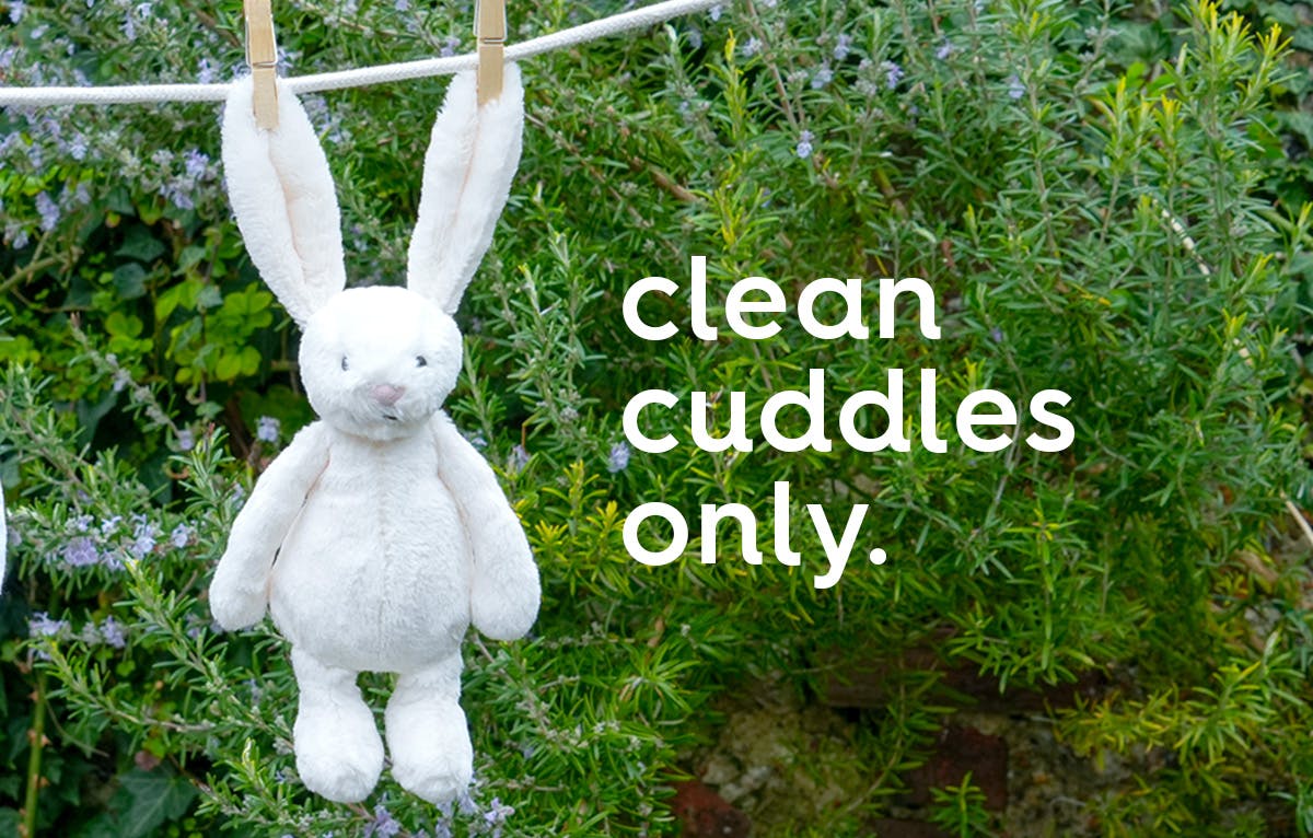 white rabbit cuddly toy on a washing line. text: clean cuddles only