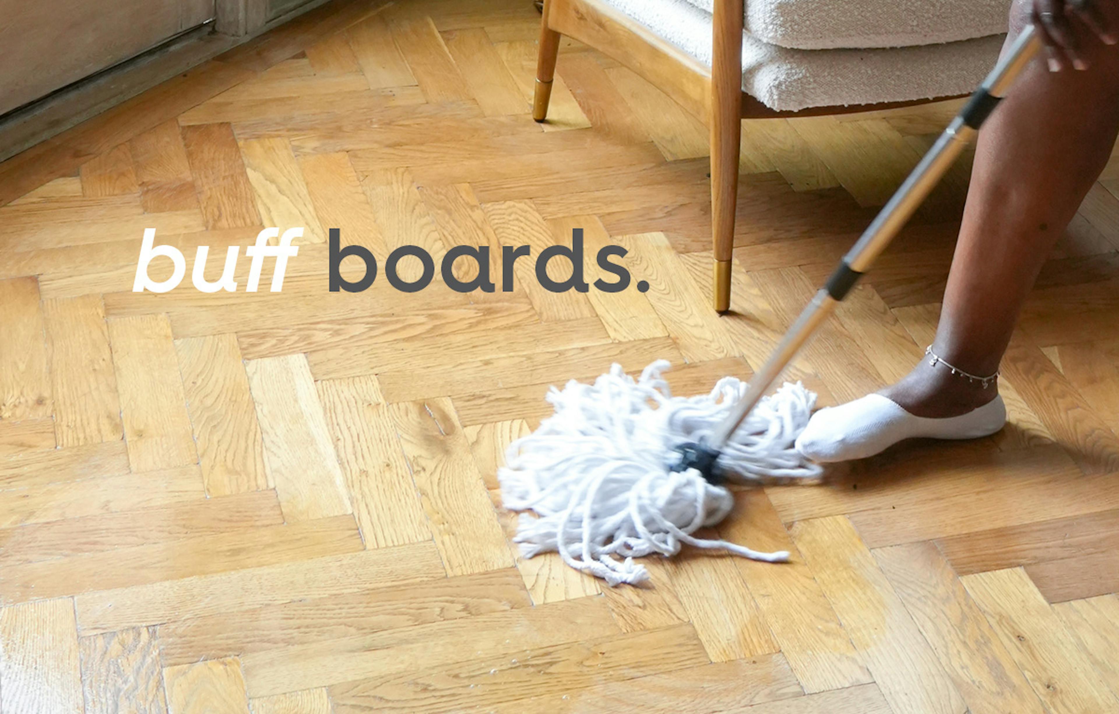 a wooden parquet floor being mopped clean. Text: buff boards.