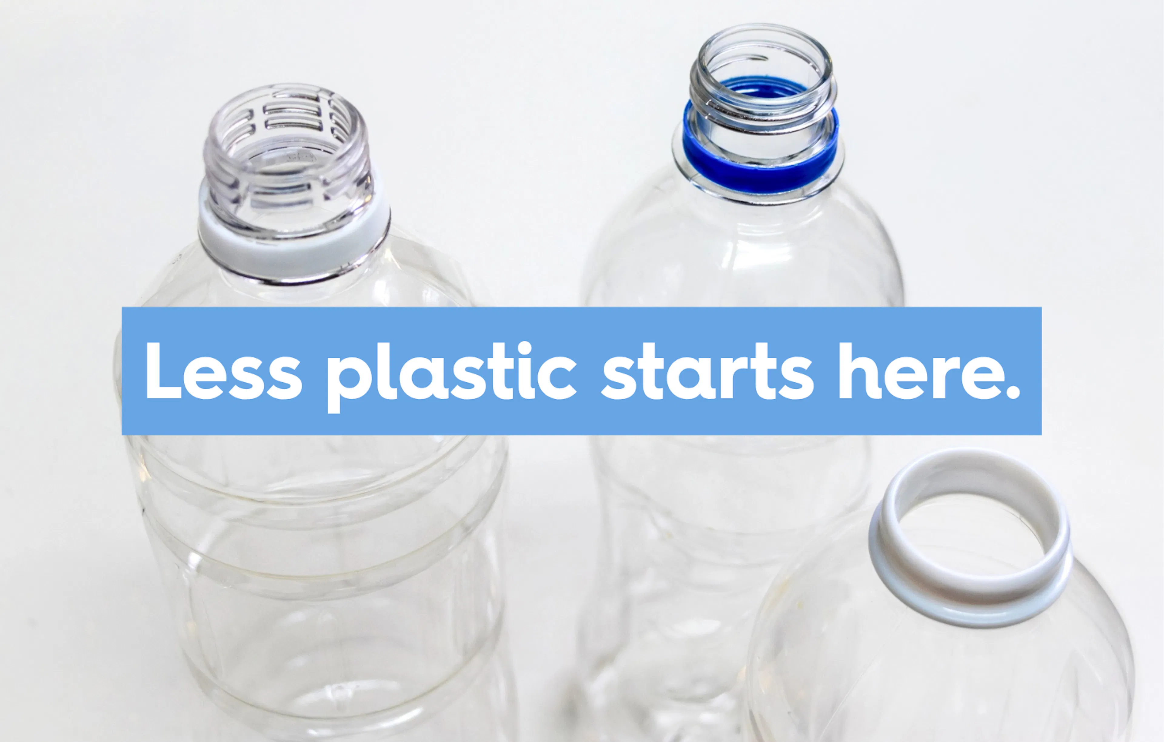 Plastic bottles on white background. Text reads: Less plastic starts here