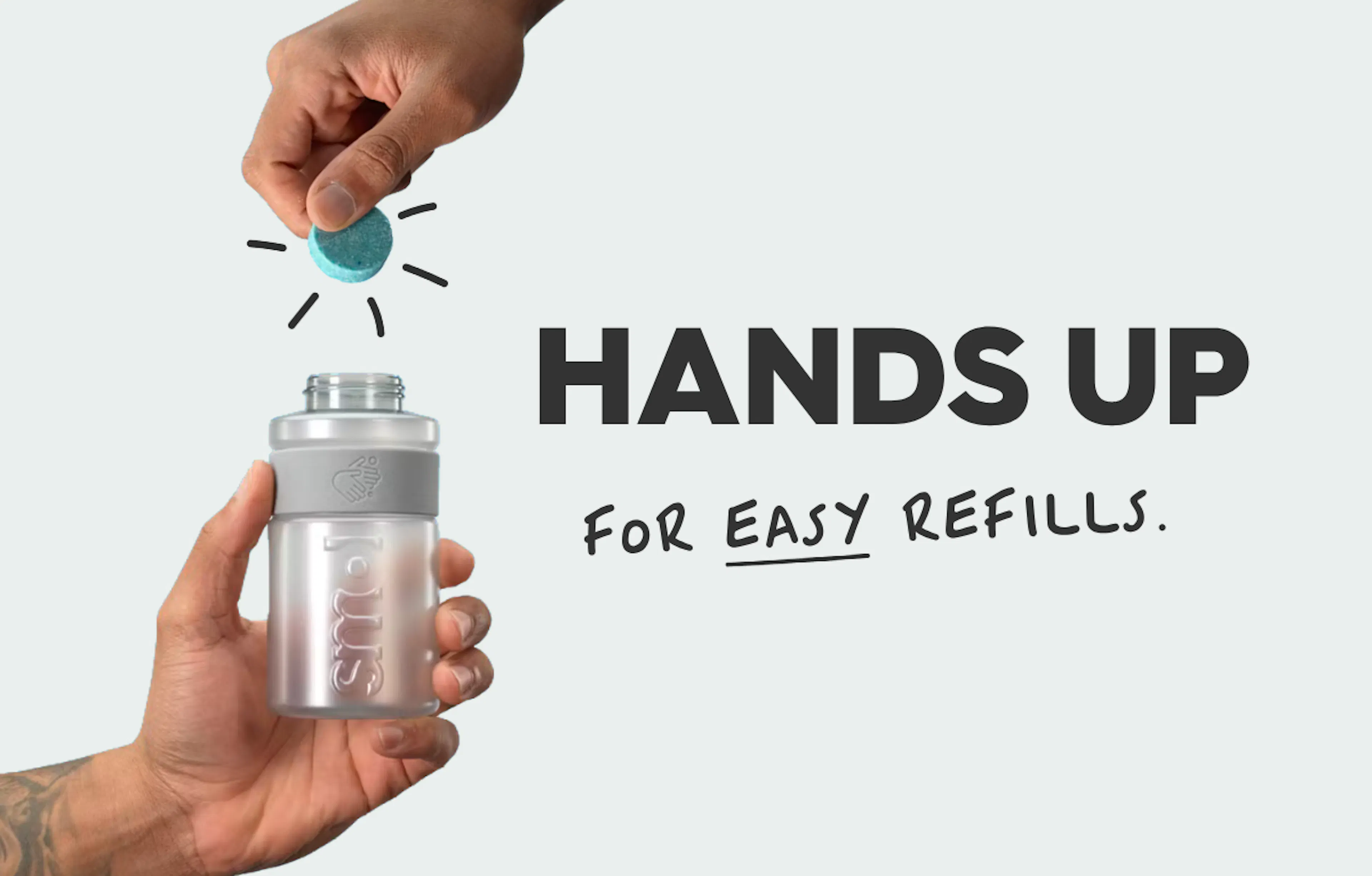 hands holding a smol handwash bottle and tablet, text reads: hands up for easy refills