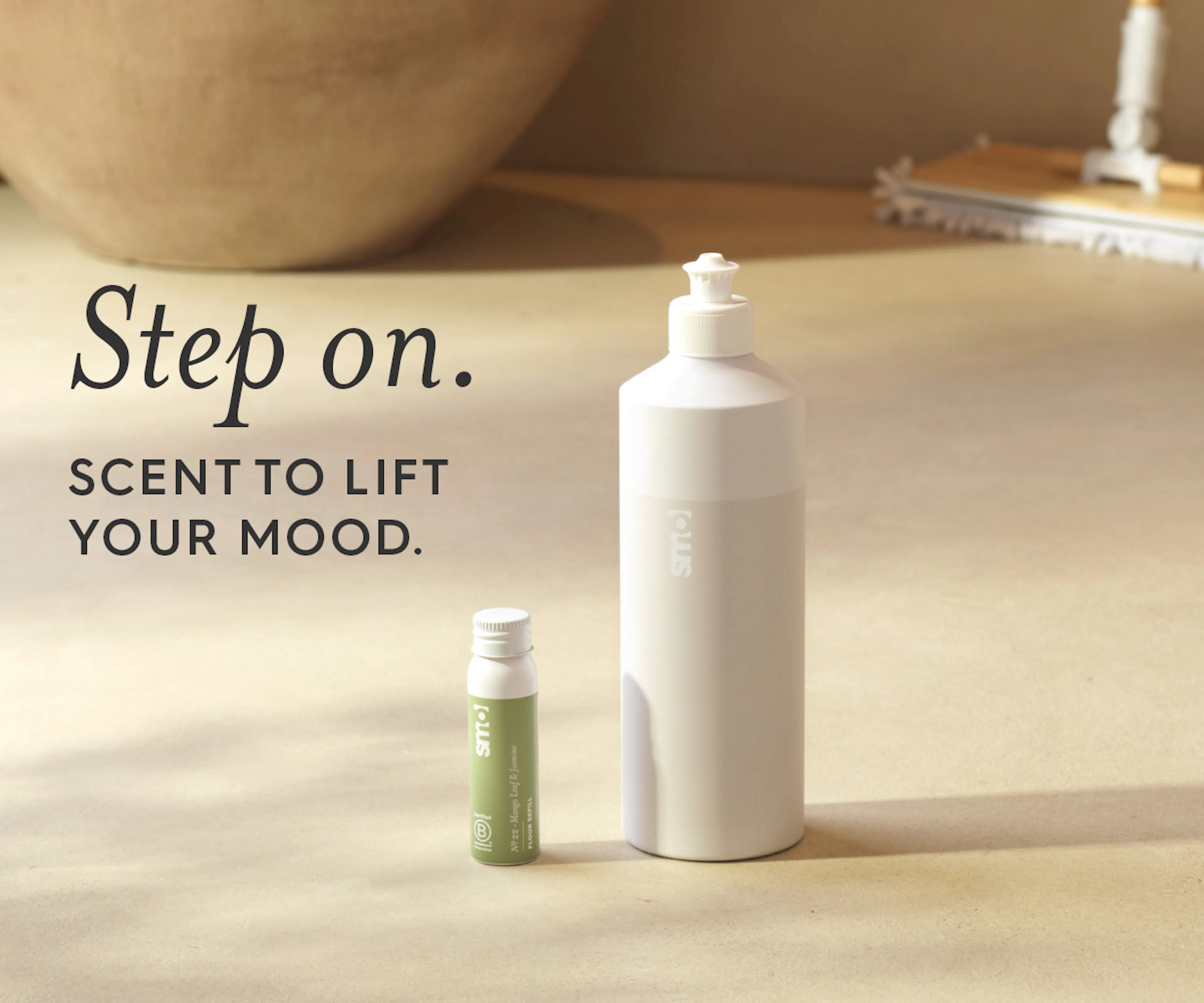 Floor reset bottle, text: step on, scent to lift your mood. 