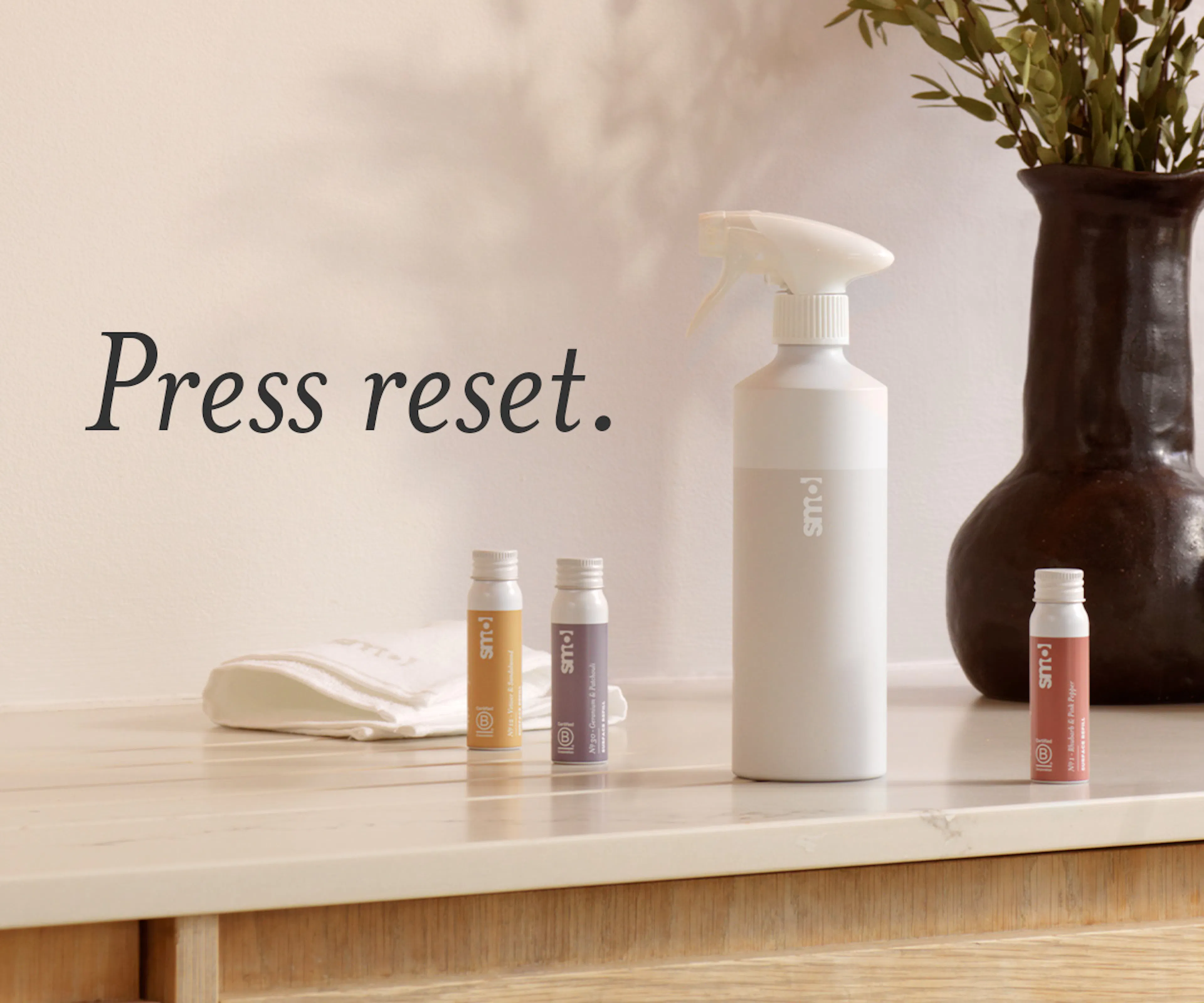 Surface reset spray and refills, text: press reset. 