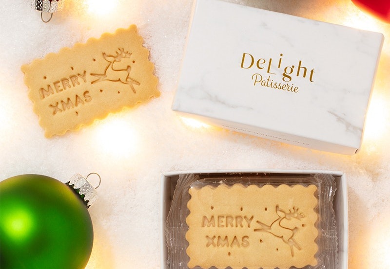 christmas swag in red and green with light brown cookies