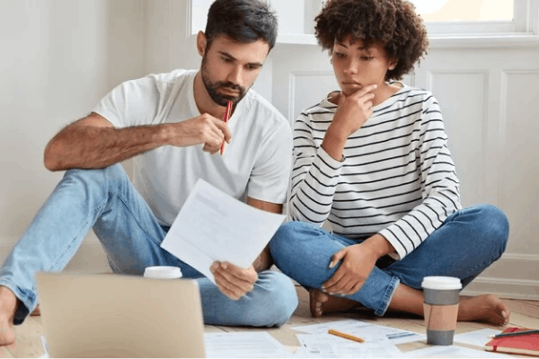 Man and woman looking at paper