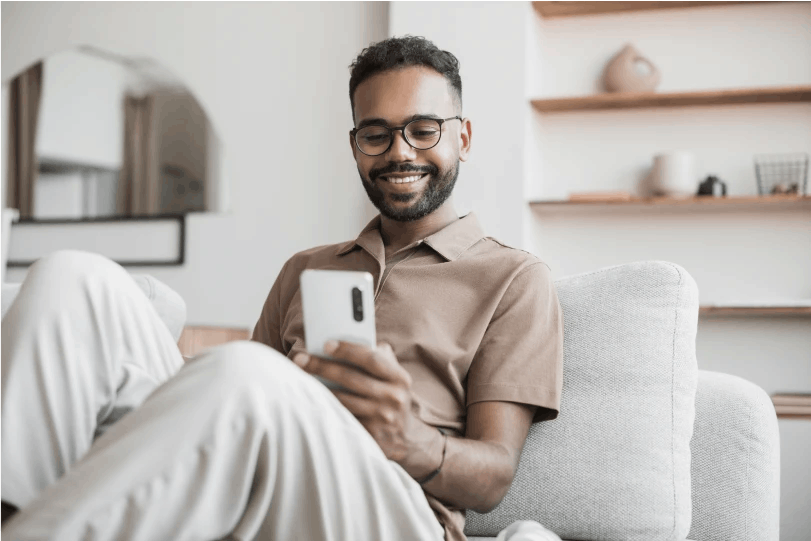 Man on phone in the couch