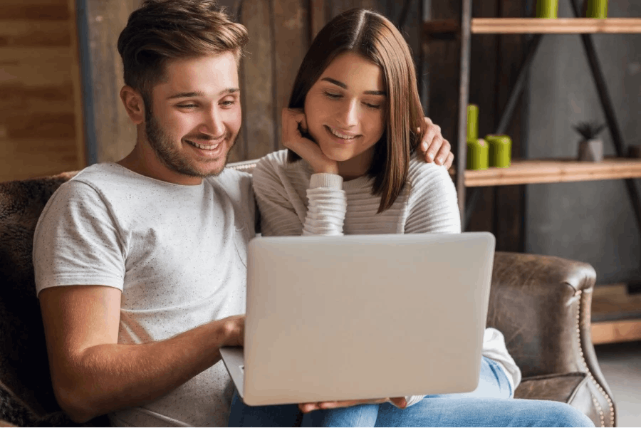 Couple looking at laptop