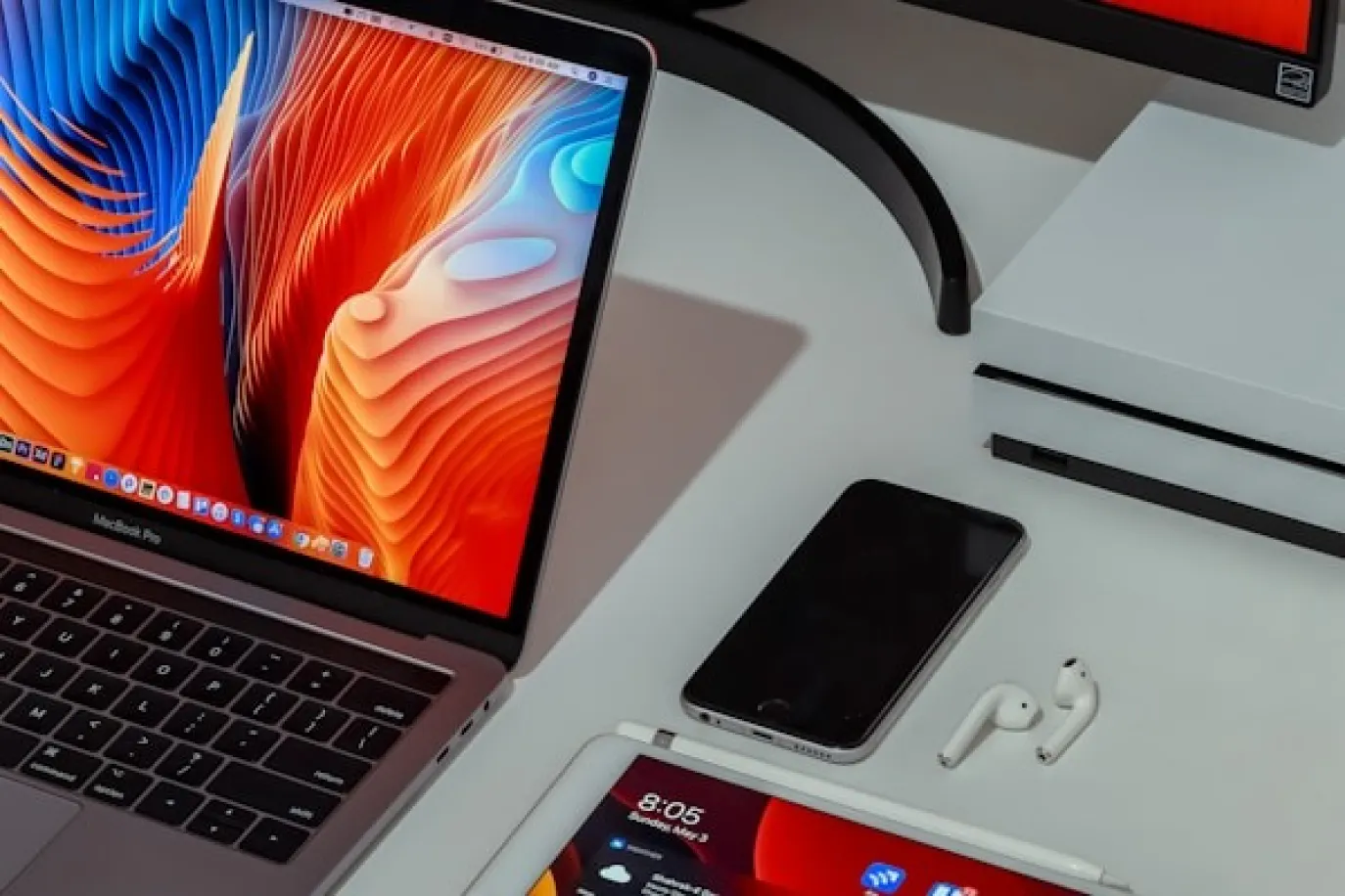 Laptop and phone on desk