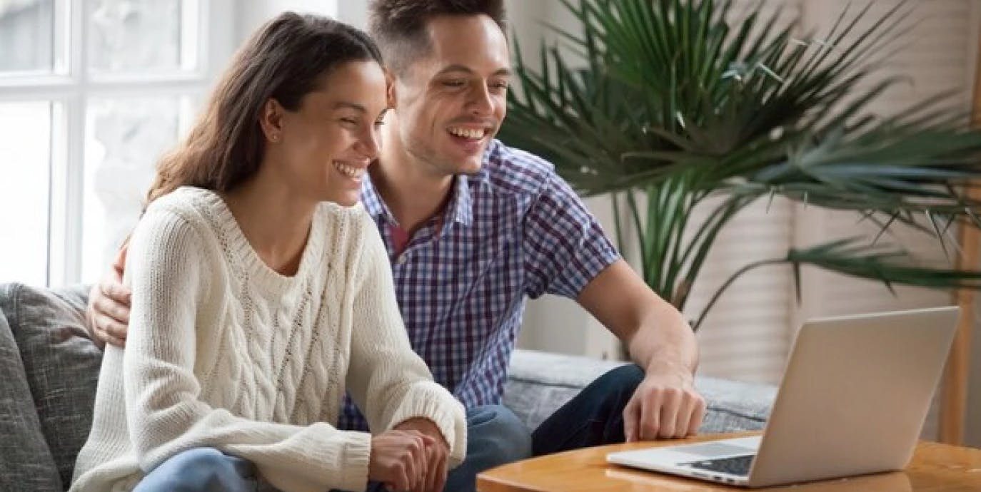 Man and women looking at laptop