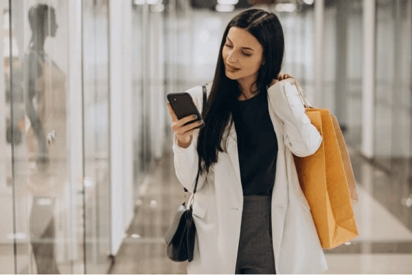 Women in store looking at phone