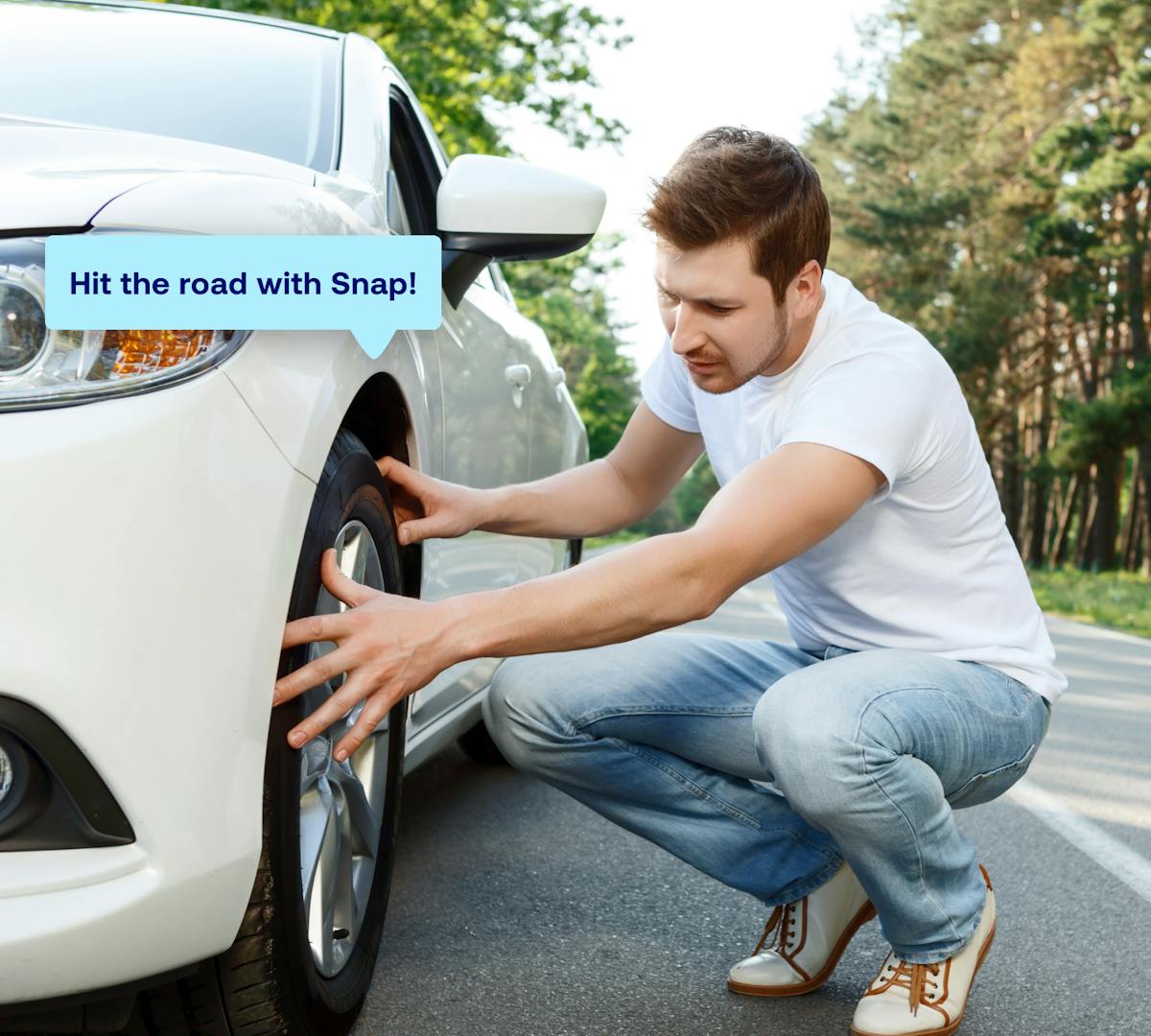 man looking at new tires and wheels on his car