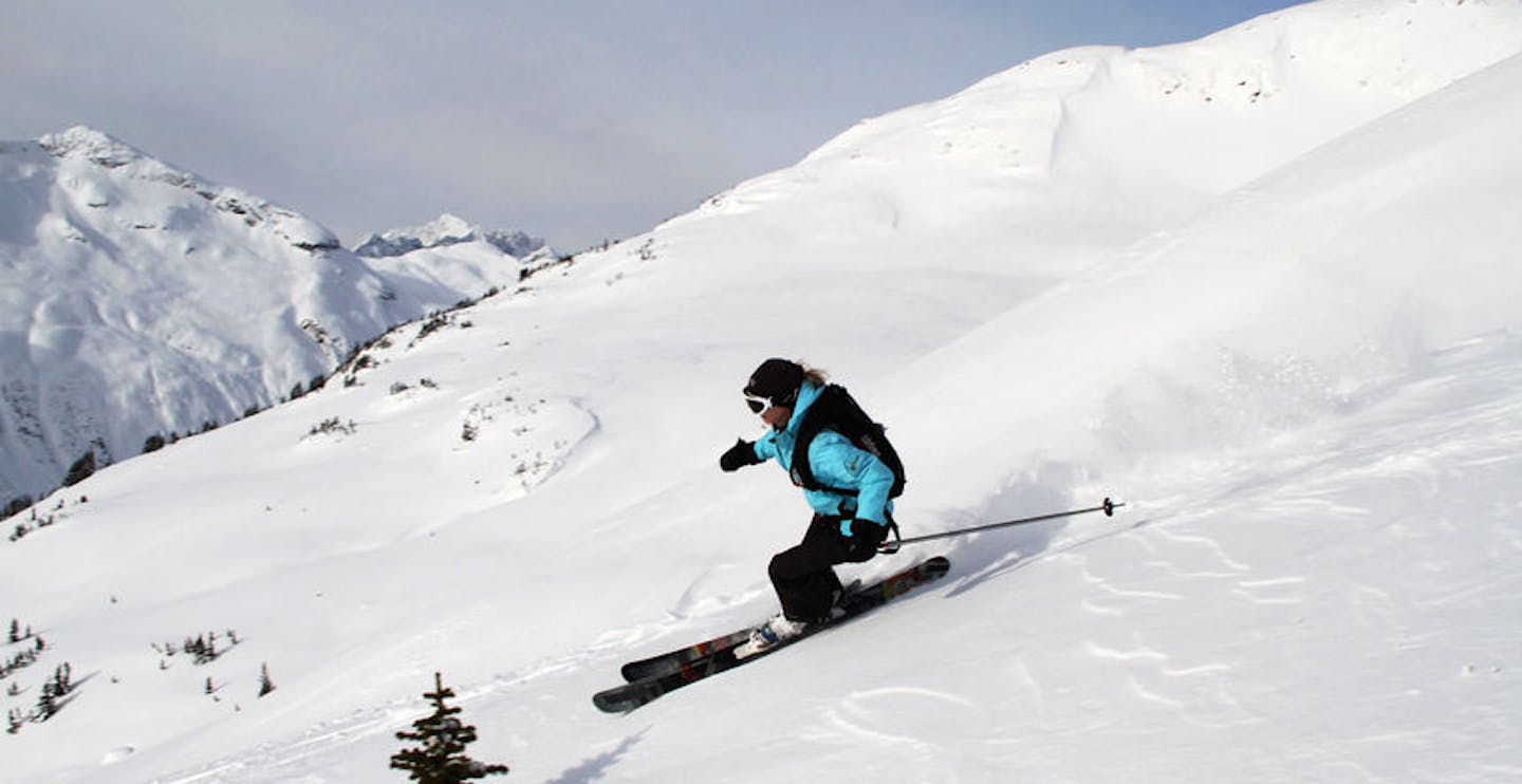 Skiing down a steep slope