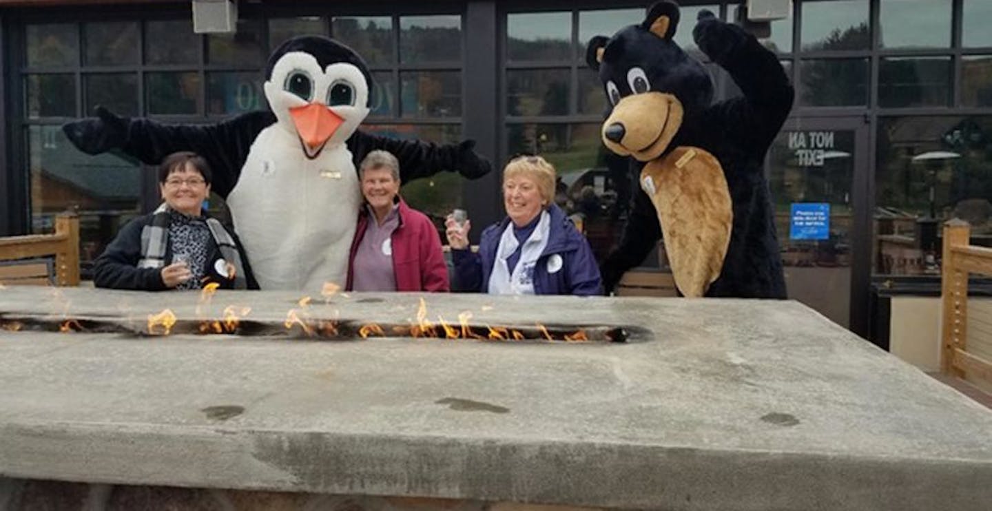 Patrons-enjoying-a-drink-on-the-deck-by-the-fire-pit