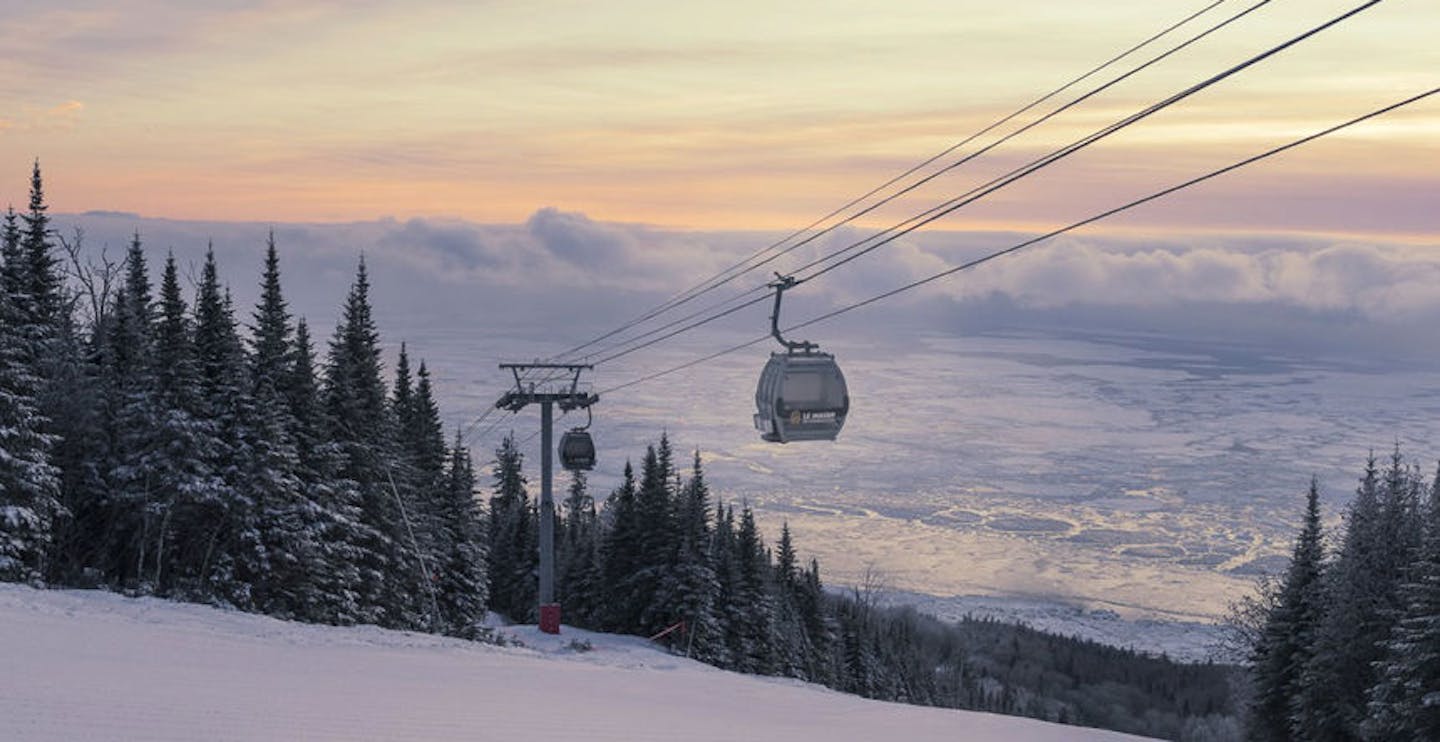 Gondola lrunning over the St. Lawrence River at Le Massif de Charlevoix in Quebec, Canada, near Montreal.