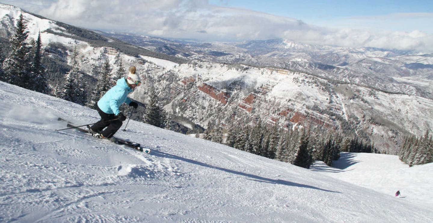 Skiing down Aspen Highlands