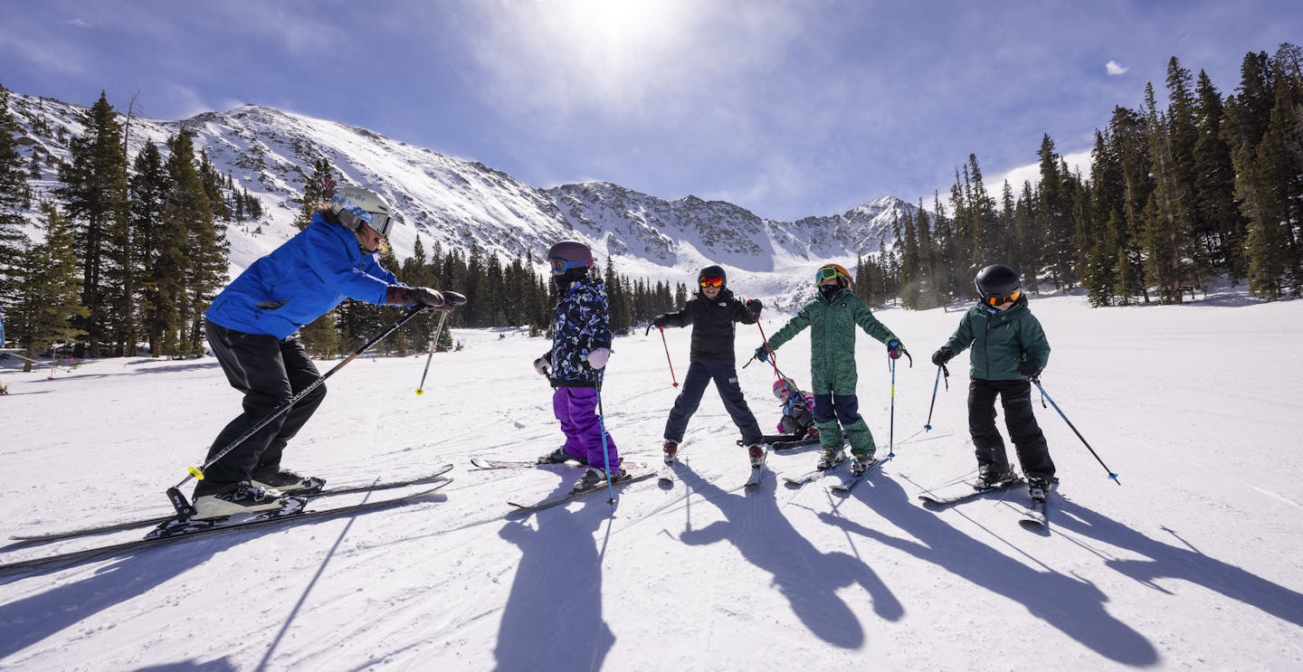 Children enjoying a private ski lesson at Arapahoe Basin (A-Basin) near Denver, Colorado.