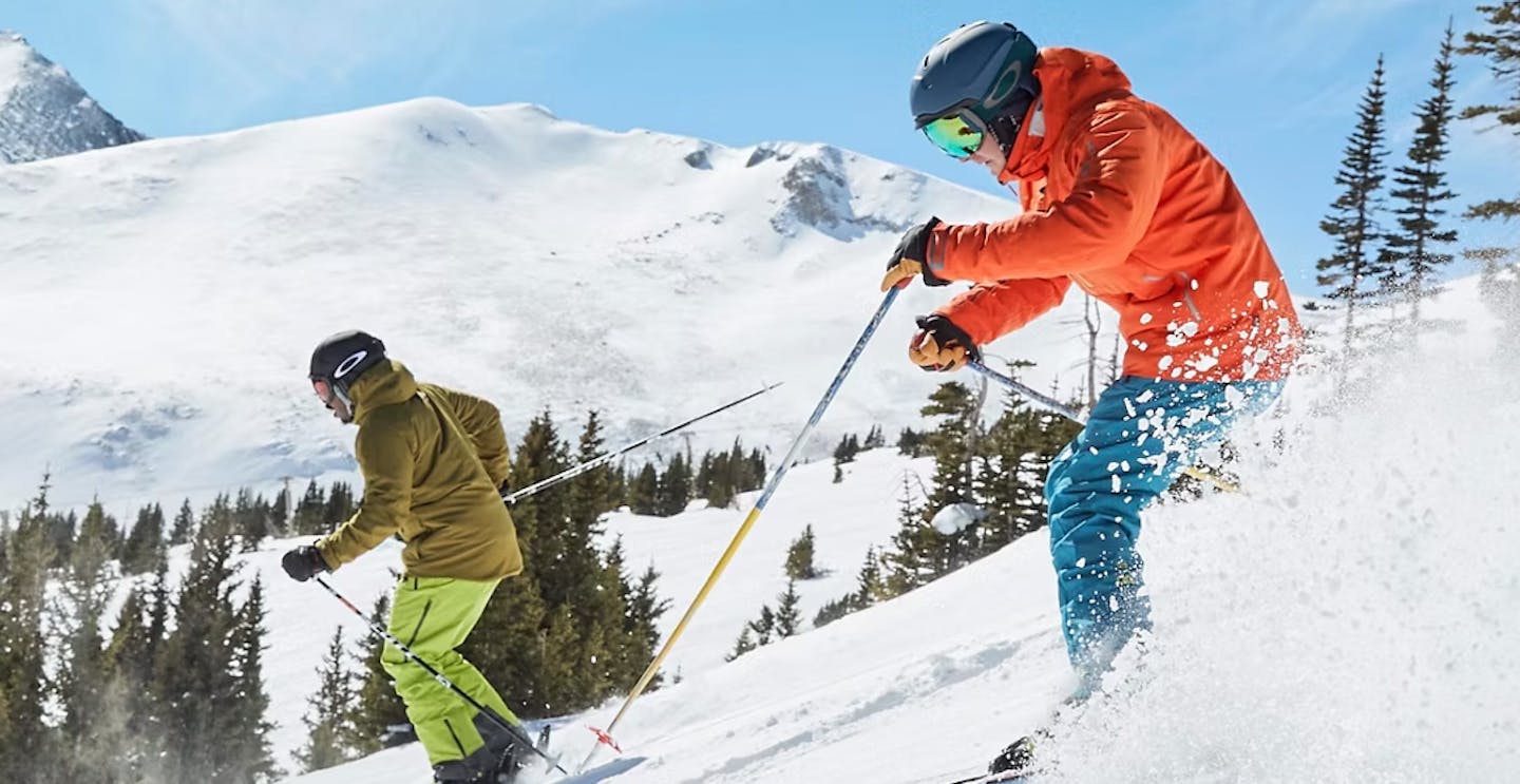 Two male skiers hitting the slopes at Breckenridge in Colorado, USA.