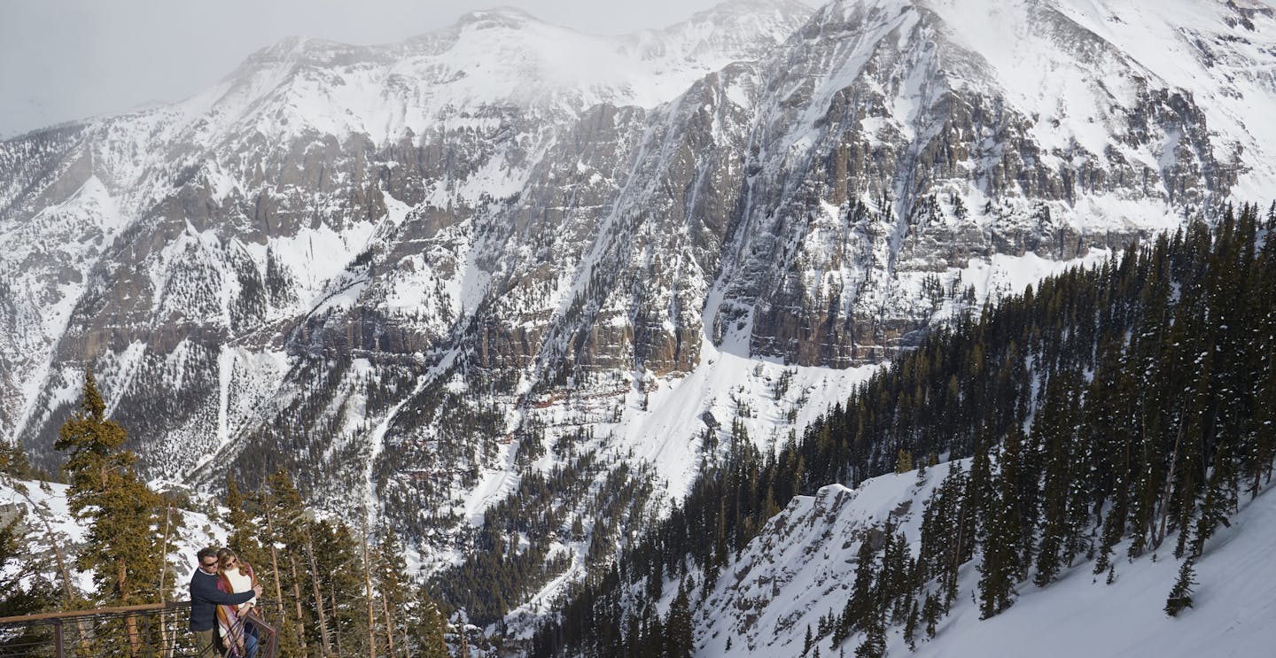 A heterosexual couple waking up to a frosty morning at Telluride Ski Resort in Colorado, USA.