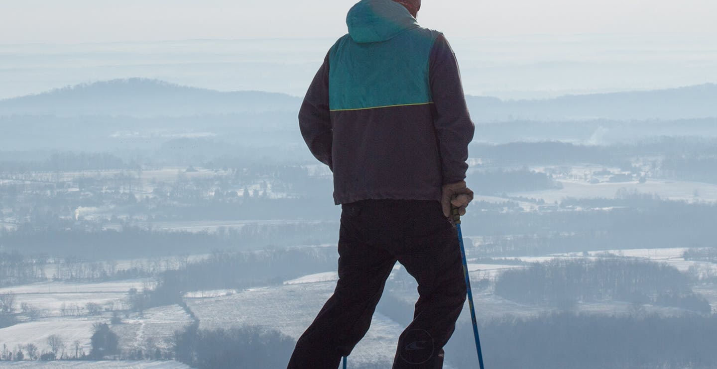 Male skier in blue ski jacket enjoying the views at Liberty Mountain Resort near Washington, D.C., in the United States.