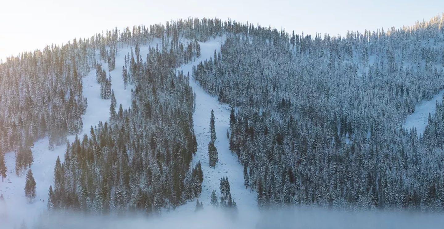 Misty morning over the peaks at Northstar California in California, USA, near Lake Tahoe.
