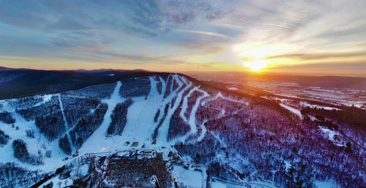 Aerial shot of the snowy slopes at Catamount in New York, USA.