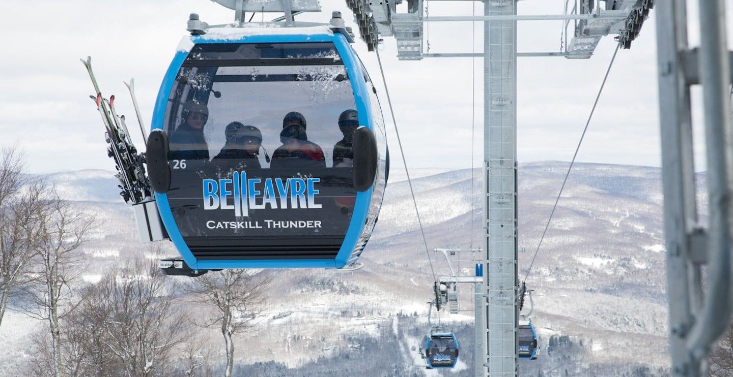 The gondola running with 6 skiers aboard at Belleayre in New York, USA.