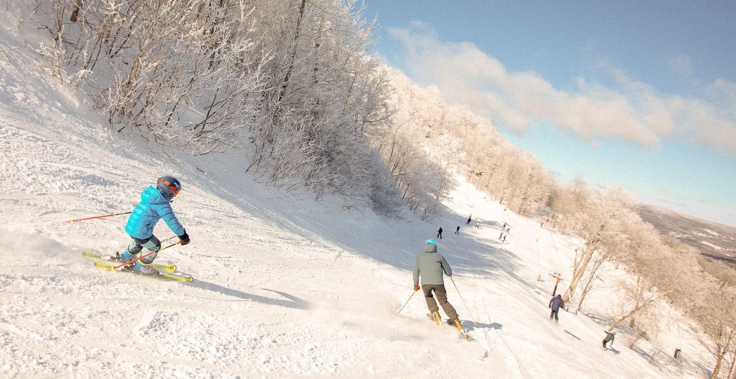 Many skiers hitting the slopes at Windham Mountain in New York, USA.