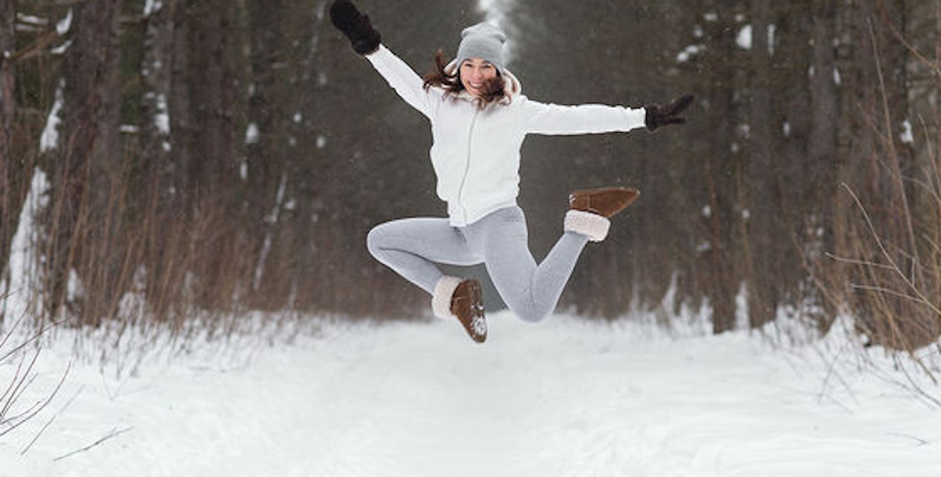 Woman jumping in a forest