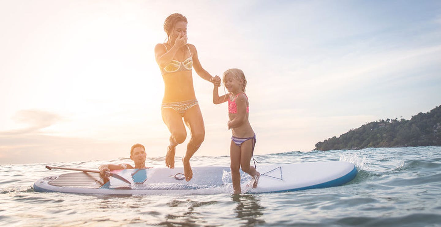 Happy family diving in the water