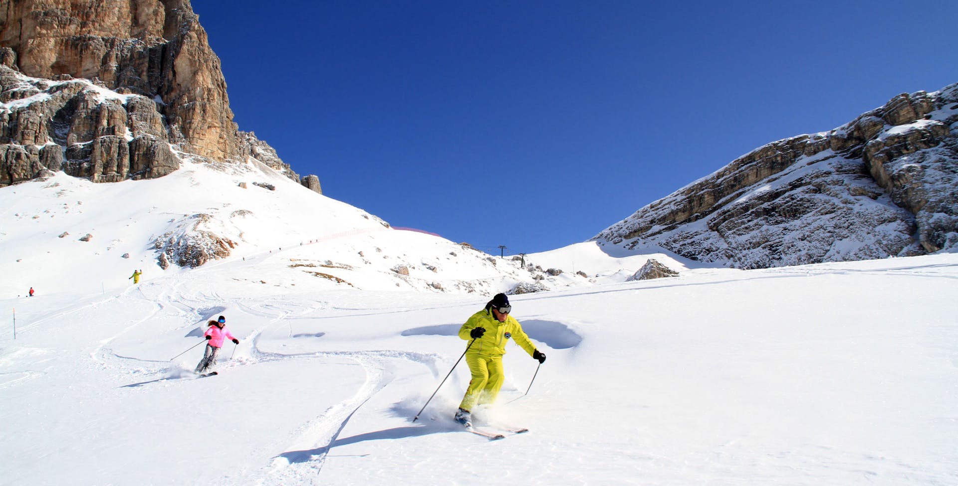 Man and woman skiing