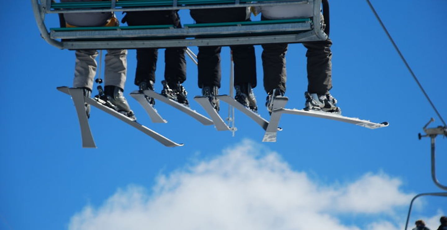 Skiers on chair lift