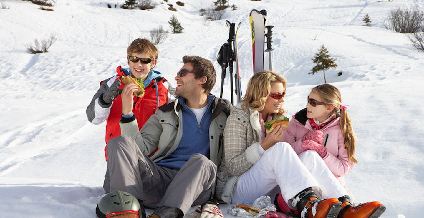 Young family sharing a picnic