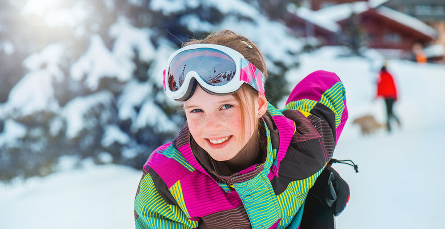 Happy kid in ski outfit