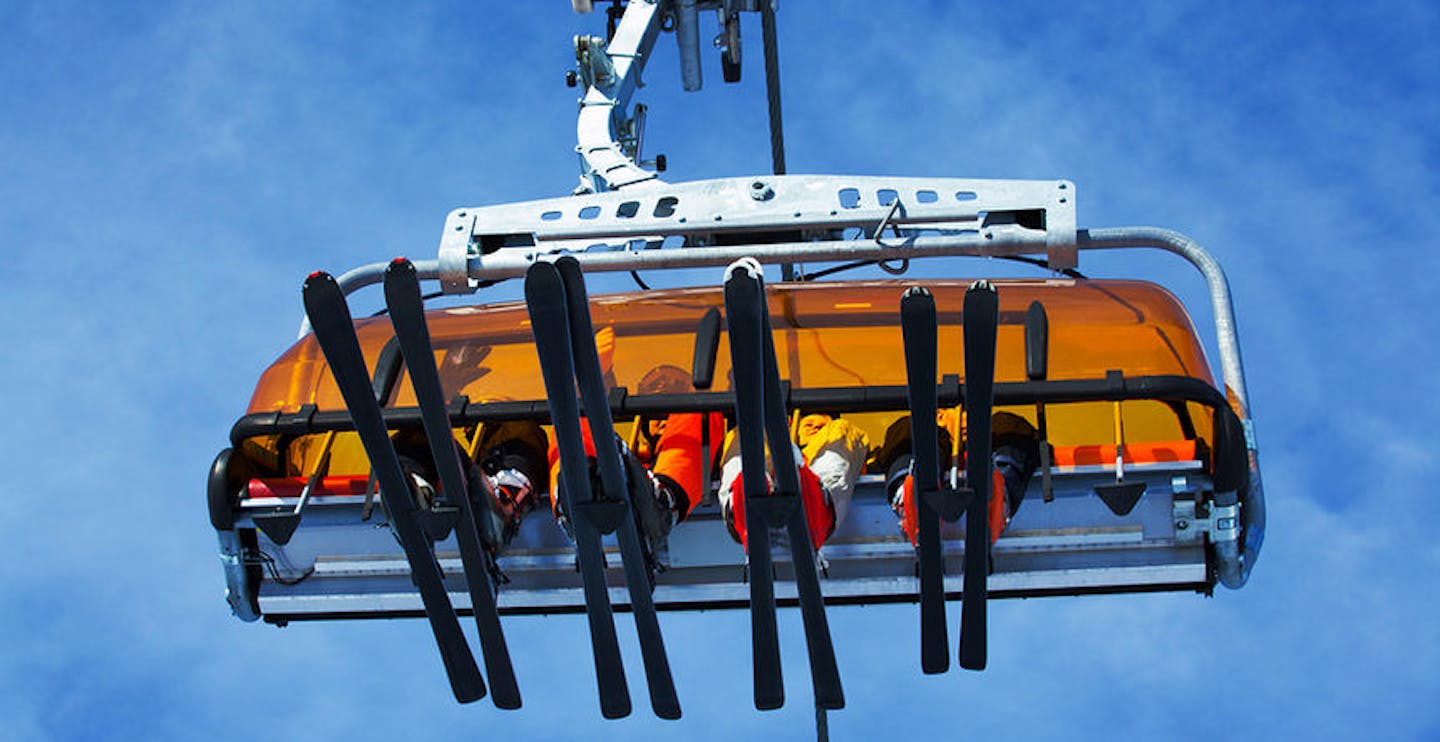 Skiers on ski lift