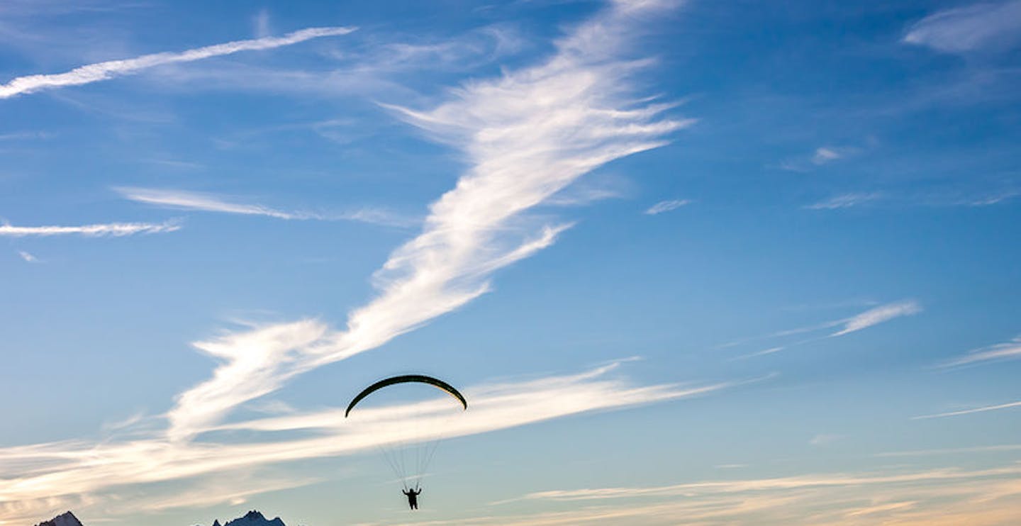 Silhouette of paraglide flying