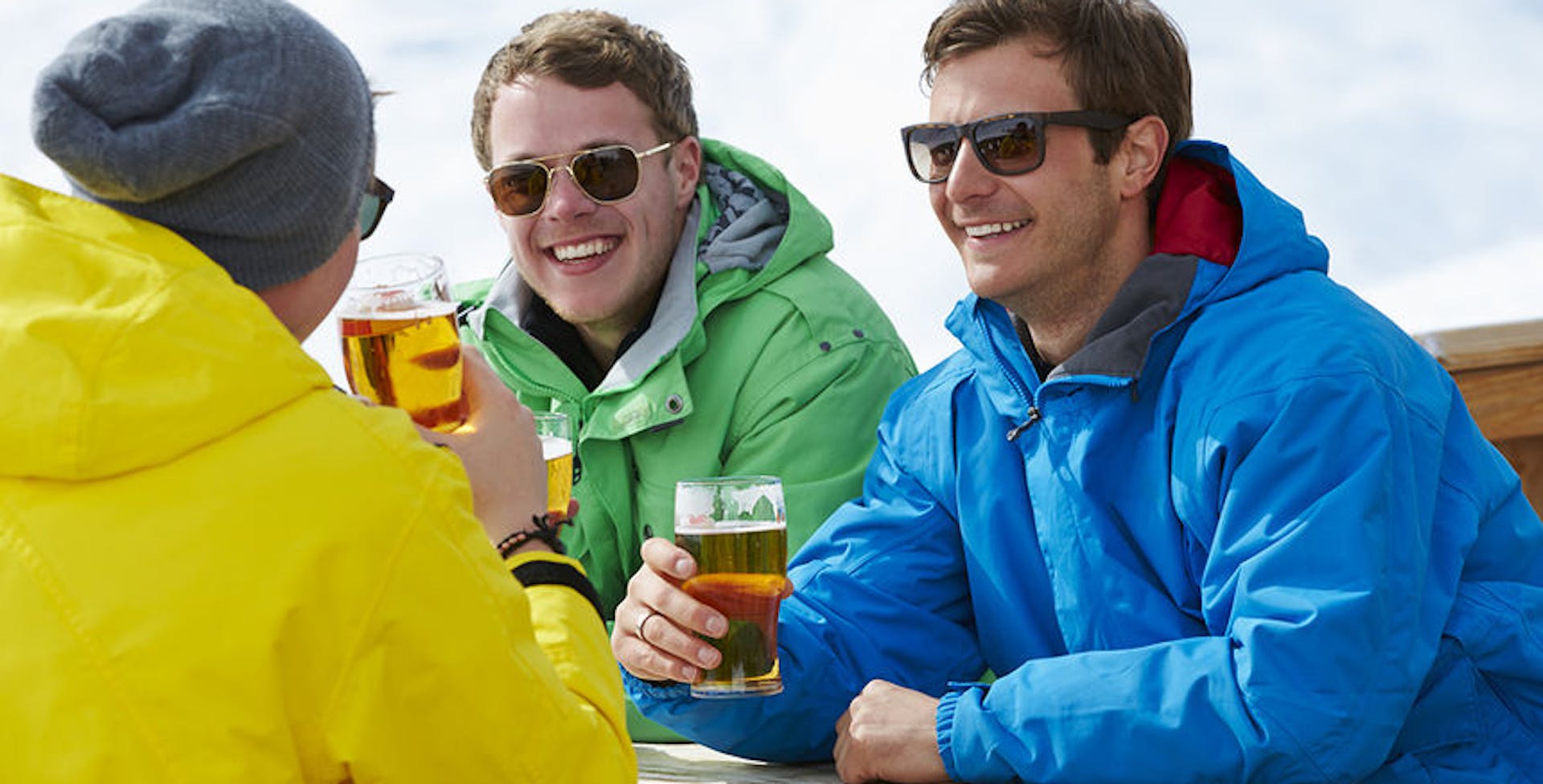 Group of young men enjoying drinks