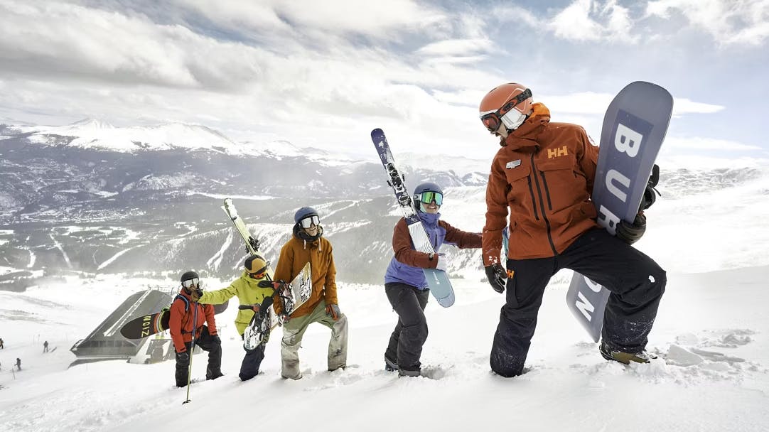 Five snowboarders uphilling to their next spot on the mountain at Keystone near Denver in Colorado, USA.