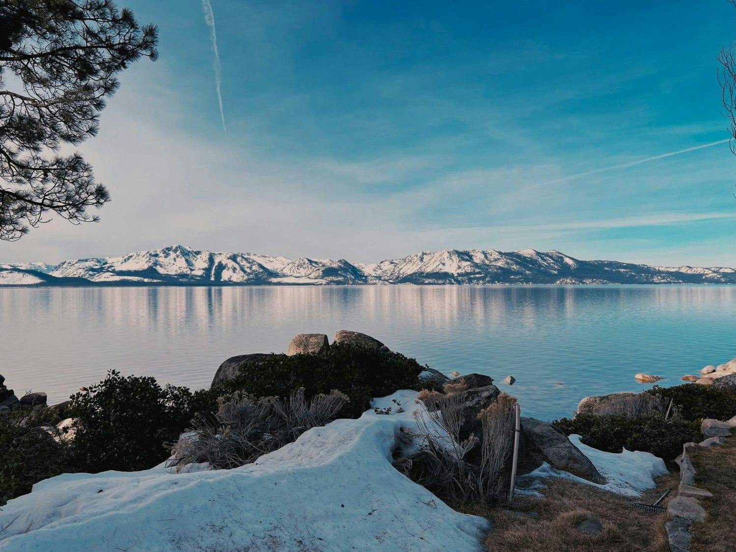 Lake Tahoe, in the Sierra Nevada Mountains, between California and Nevada, in the winter covered in snow.