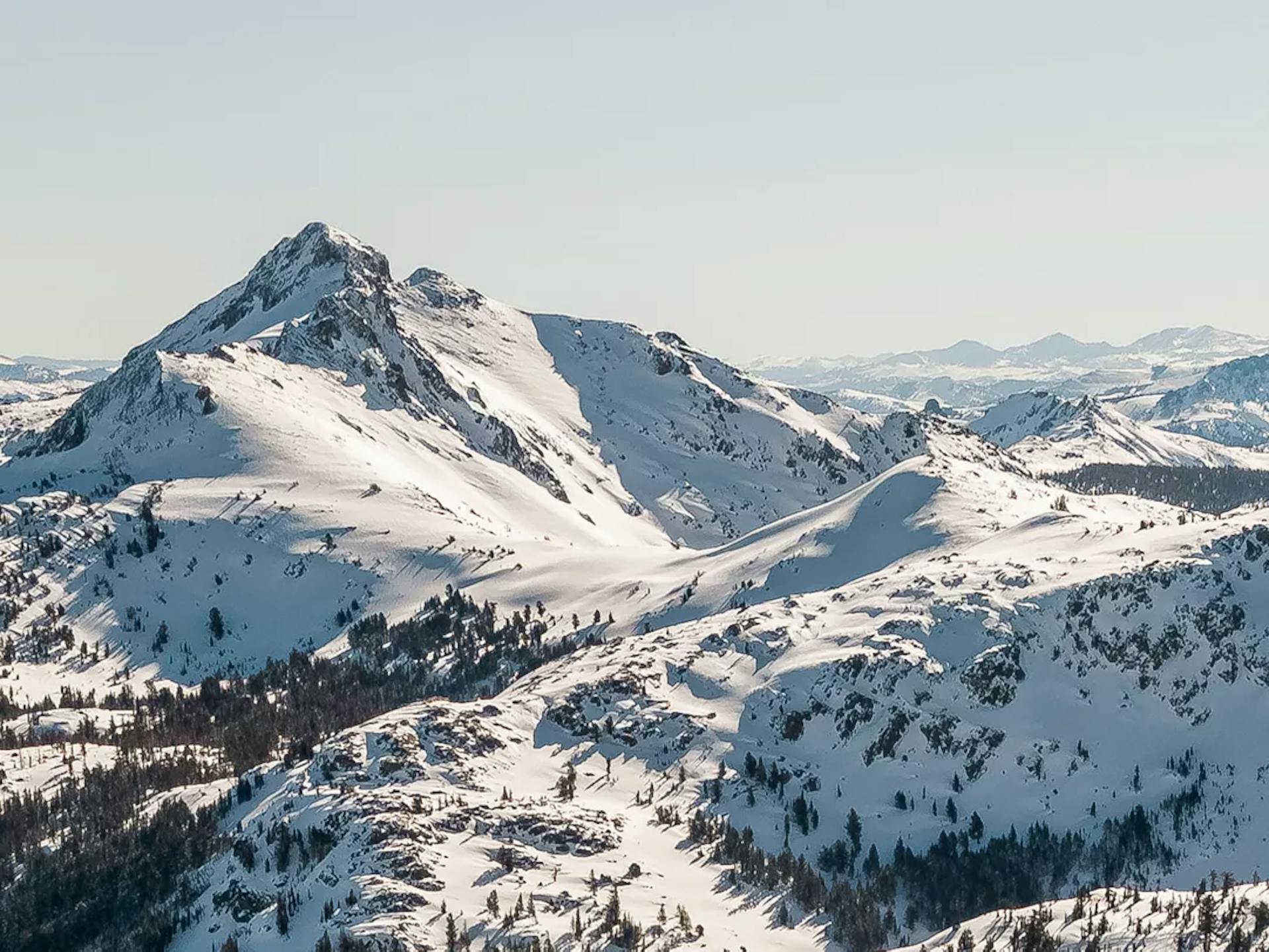 a birds eye view of the mountain at kirkwood mountain resort at sunrise