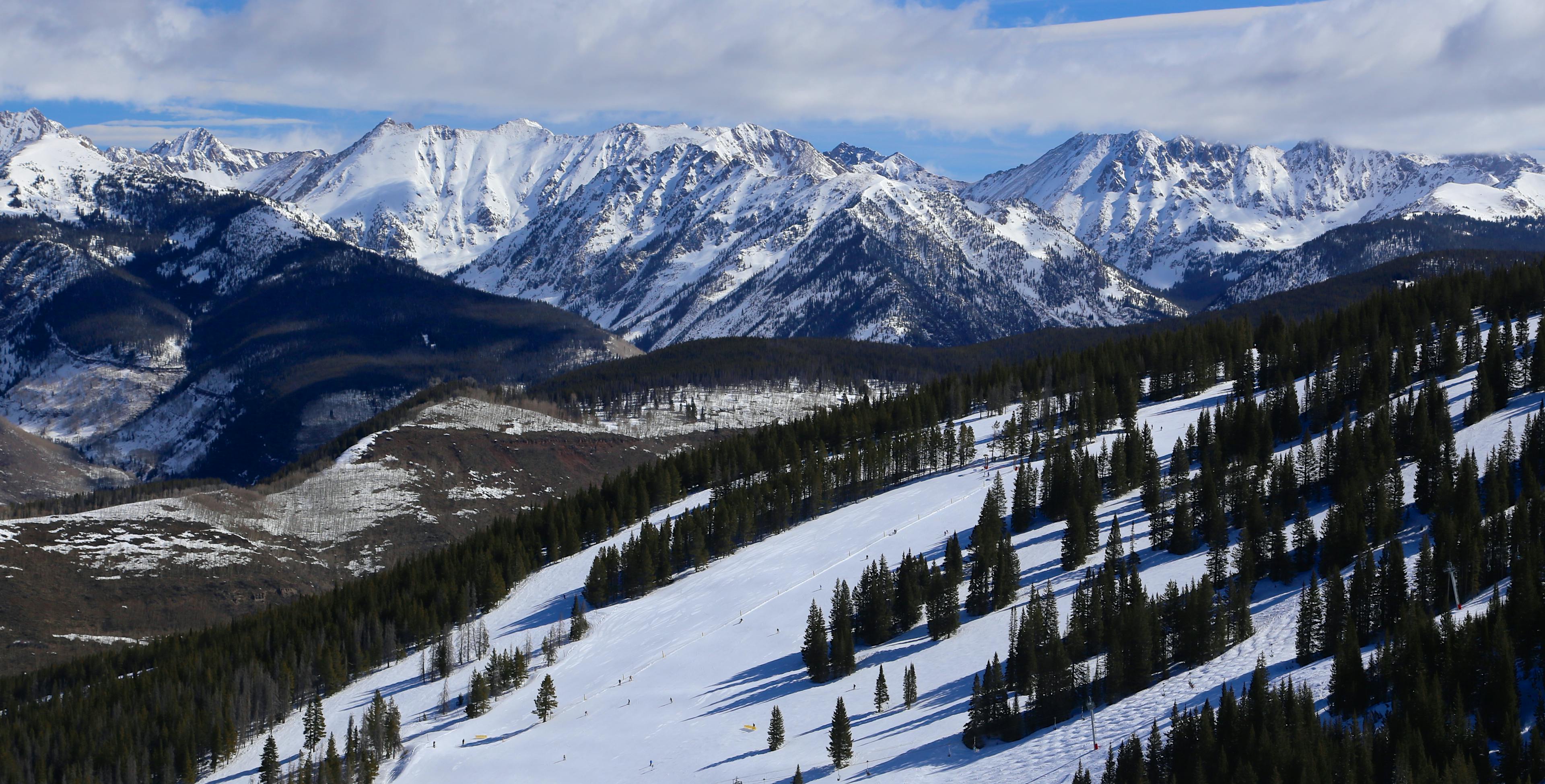 Vail ski run with view of the Gore Range