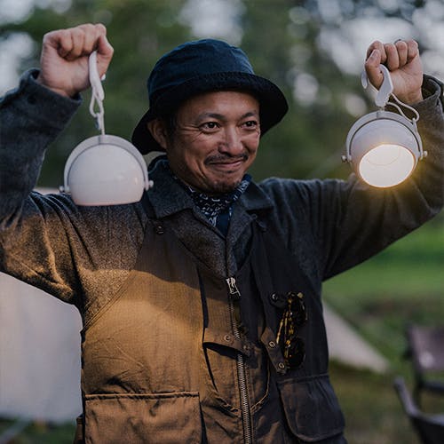 man holding lanterns