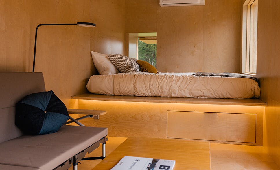 interior photo of a room with warm lighting and wooden walls