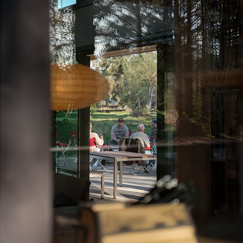 looking at people through a building